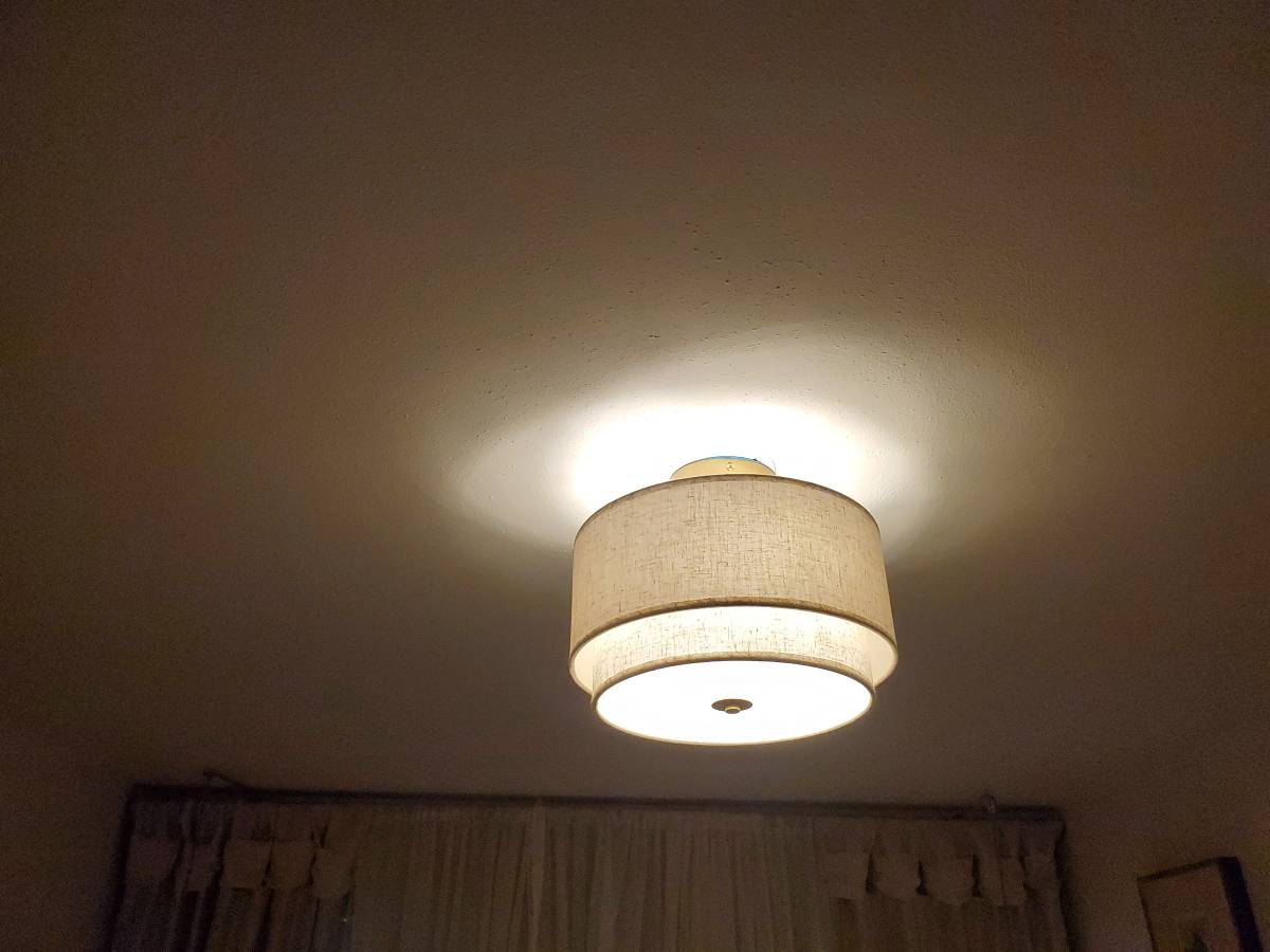 New ceiling light fixture installed and illuminated