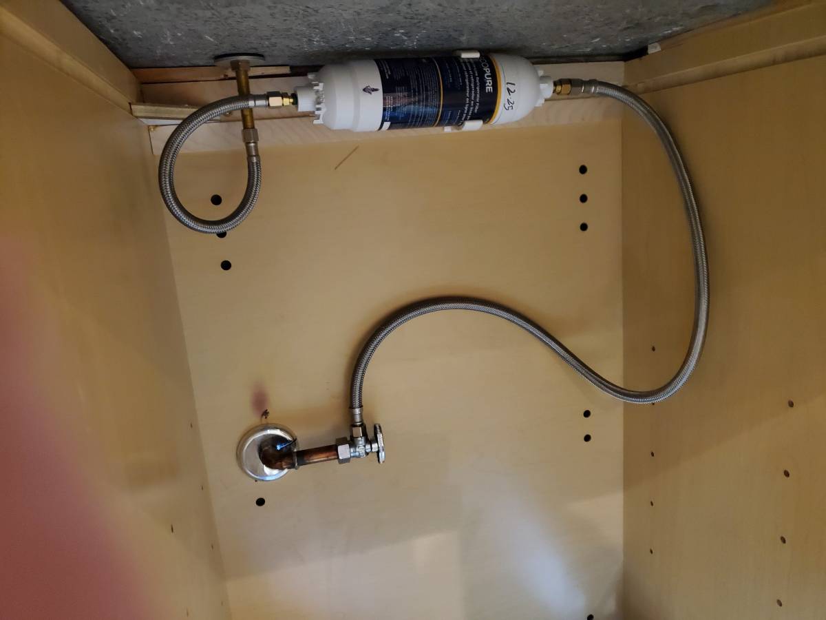 Water filter and supply lines installed under a sink